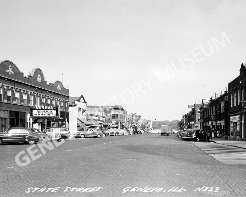 Product Description: Circa 1948 - State and Fourth Streets looking east, including the 300 block of State Street and cars parked in front of Geneva Theatre.</br></br>Available sizes:</br></br>8 x 10 = $20.00; 11 x 14 = $30.00; 16 x 20 = $40.00; 20 x 30 = $55.00; 24 x 36 = $65.00</br></br>In-store pickup free. Shipping available.</br> No. 5 - State and Fourth Streets, Circa 1948