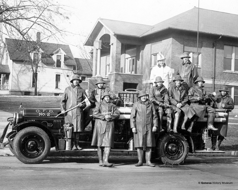 Product Description: Circa 1925 - Geneva Fire Department with new Seagrave Suburbanite Fire Truck No. 2 parked in front of Geneva City Hall on South First Street. The house in the background was moved to 428 Hamilton Street.</br></br>Available sizes:</br></br>8 x 10 = $20.00; 11 x 14 = $30.00; 16 x 20 = $40.00; 20 x 30 = $55.00; 24 x 36 = $65.00</br></br>In-store pickup free. Shipping available.</br> No. 15 - Geneva Fire Department, Circa 1925