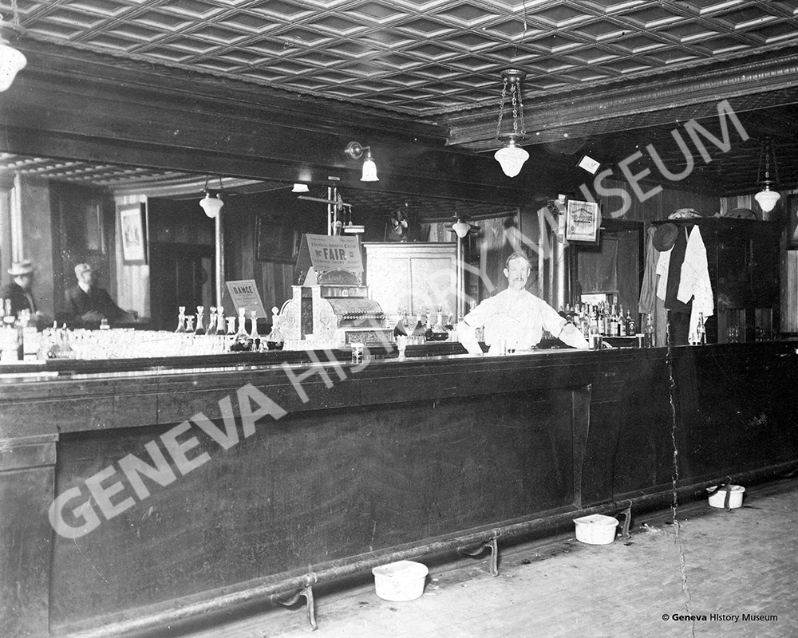 Product Description: Circa 1915 - Interior view of Swedish immigrant Gus Schutz Saloon at the corner of First and State Streets at 30 West State Street. The building was constructed in 1907 and it is currently occupied by Sergio's Cantina and 1910 Bar on the second floor.</br></br>Available sizes:</br></br>8 x 10 = $20.00; 11 x 14 = $30.00; 16 x 20 = $40.00; 20 x 30 = $55.00; 24 x 36 = $65.00</br></br>In-store pickup free. Shipping available.</br> No. 16 - Interior view of Gus Schutz Saloon