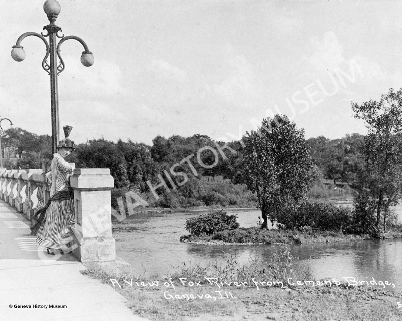 Product Description: CIrca 1910s - Postcard of a woman standing on State Street bridge overlooking the Fox River. The first concrete bridge was constructed in 1909 and in 1992 it wasreconstructed.</br></br>Available sizes:</br></br>8 x 10 = $20.00; 11 x 14 = $30.00; 16 x 20 = $40.00; 20 x 30 = $55.00; 24 x 36 = $65.00</br></br>In-store pickup free. Shipping available.</br> No. 18 - State Street Bridge Woman